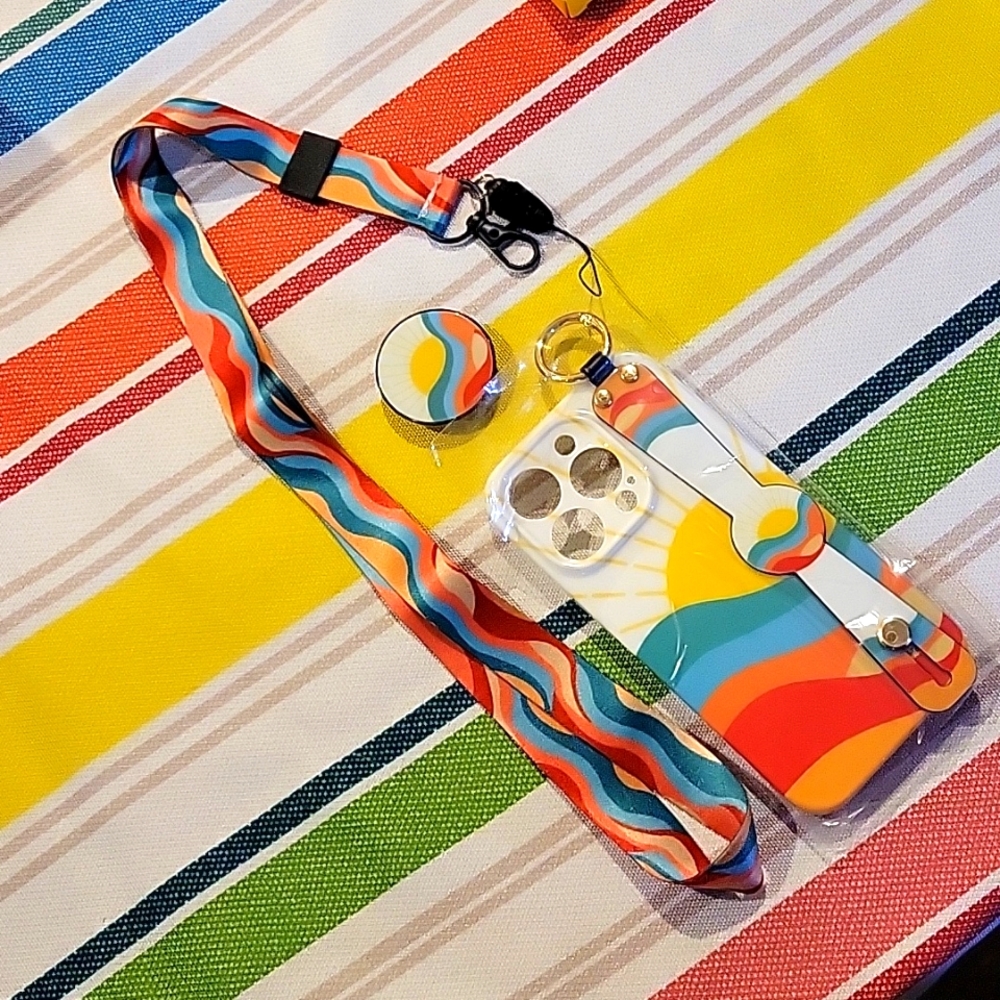 Brand new iPhone 14 Pro phone case.Has matching handstrap, lanyard, and pop-it